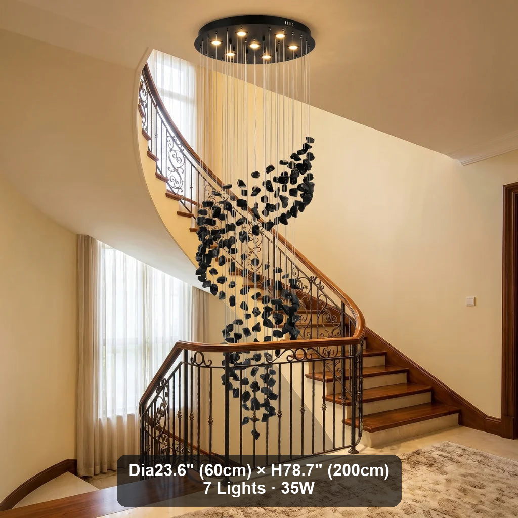 Black Obsidian Tiered Chandelier Gema hanging in luxury staircase foyer