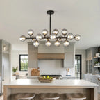 Vesper 16-Light Modern Farmhouse Pendant Light with Glass Shade warm light illuminated view
