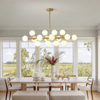 Vesper 16-Light Modern Farmhouse Pendant Light with Glass Shade in living room setting