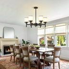 Clara matte black farmhouse chandelier side angle view on white background