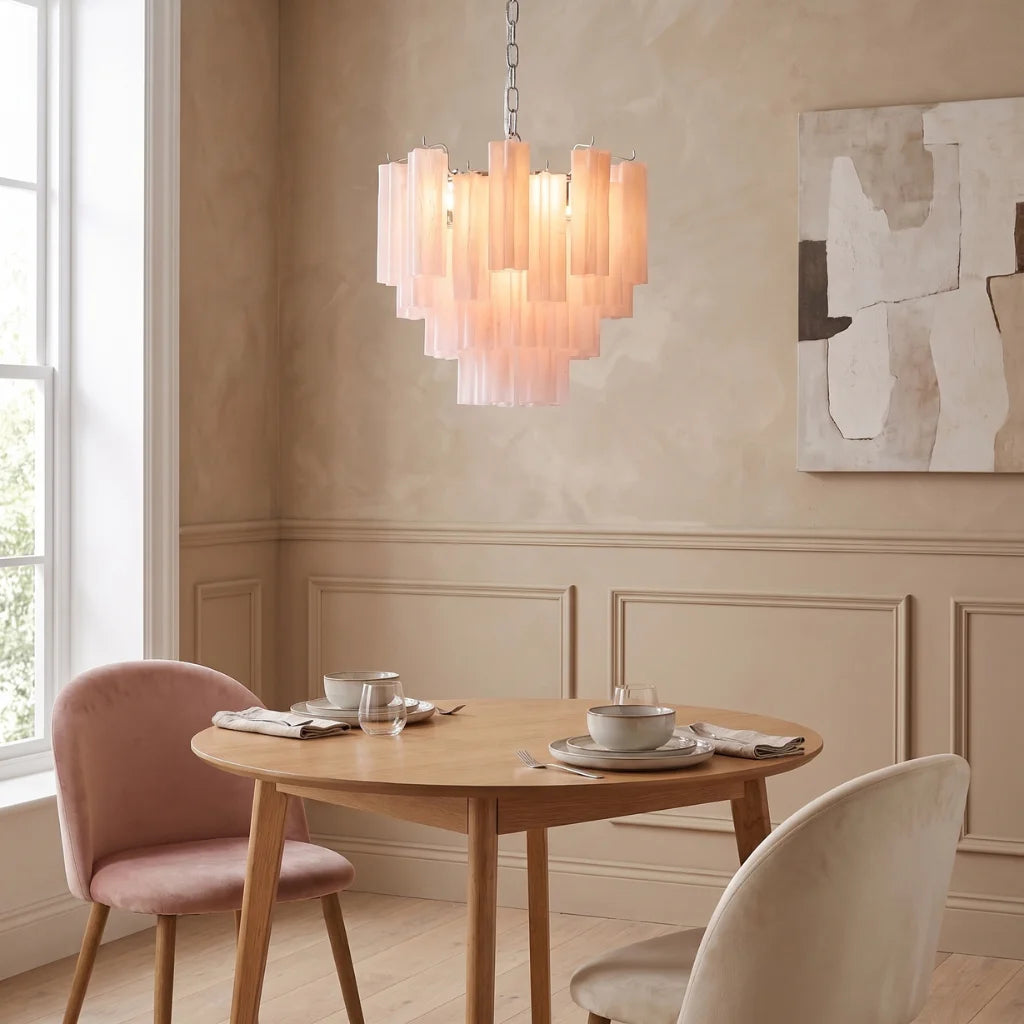 Tubular glass chandelier illuminated warm glow at night
