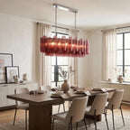 Tubular glass pendant light illuminated warm glow